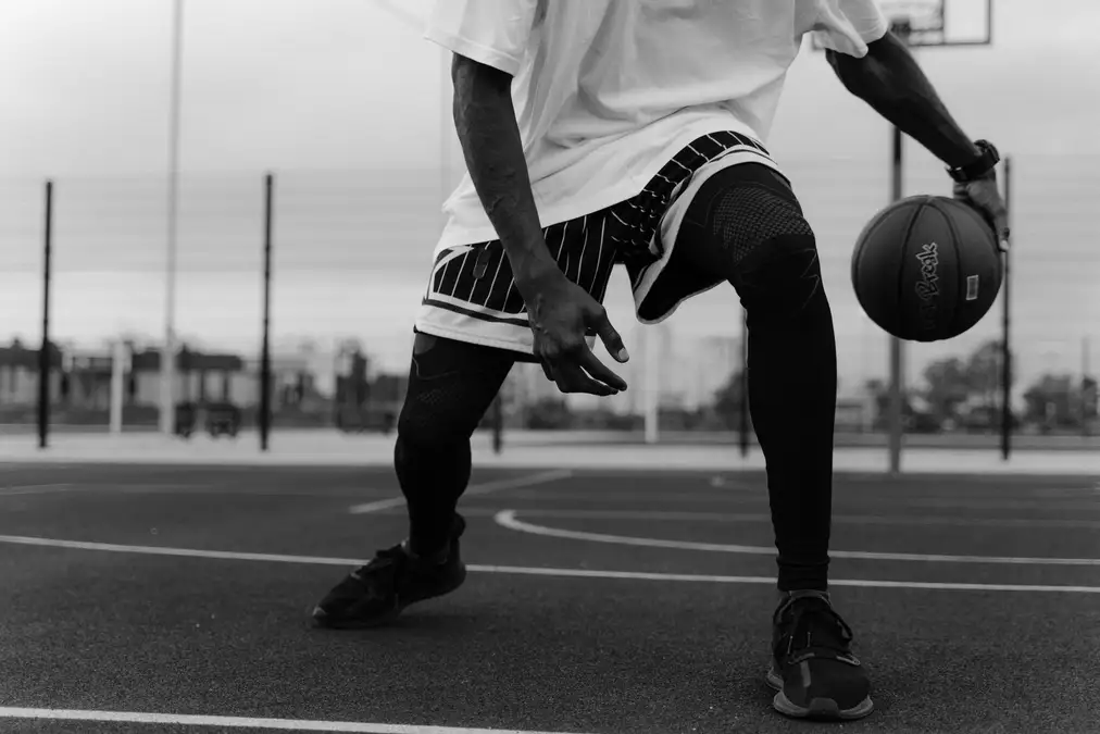 A man is playing with basketball.